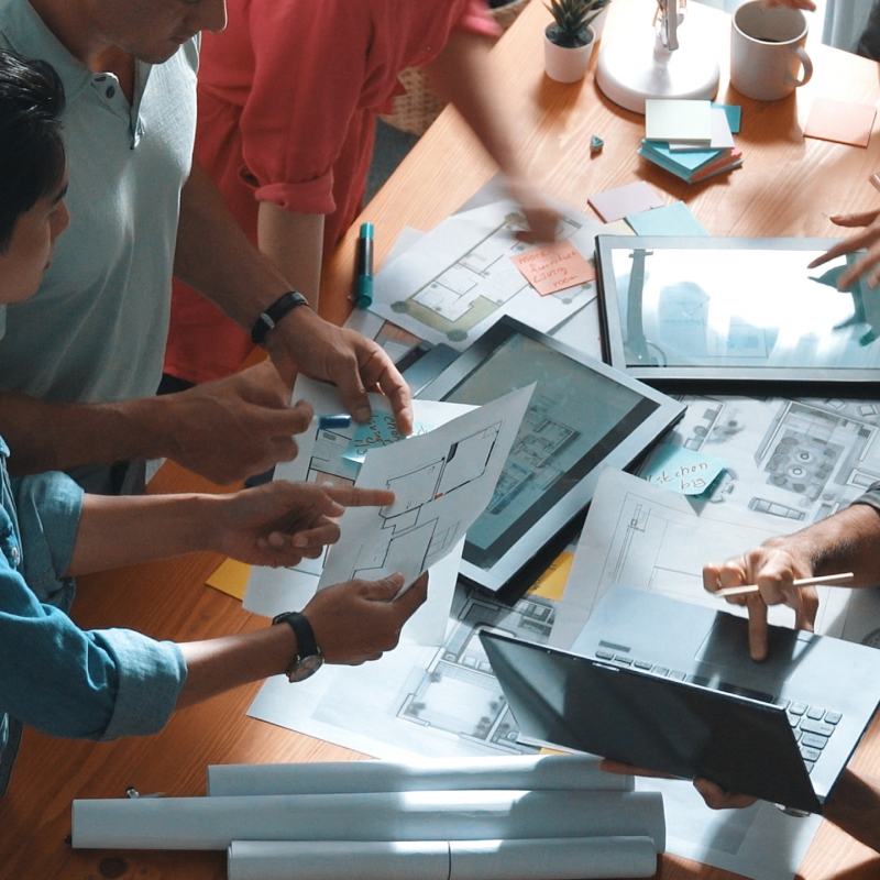 Time lapse of civil engineer team working together to plans building construction. Top view of architect designer walking and joining meeting while talking idea while looking at tablet. Symposium.
